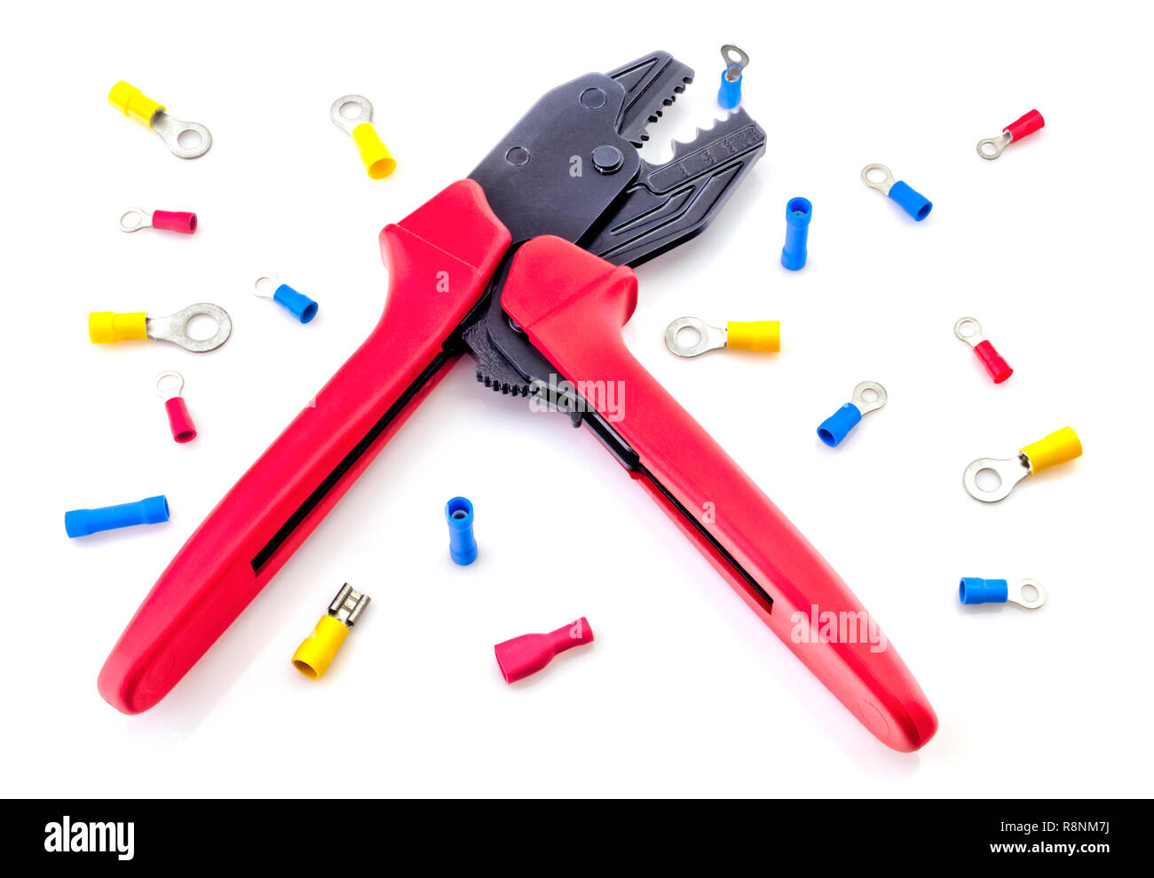 Crimping tool and electrical connectors isolated on white background