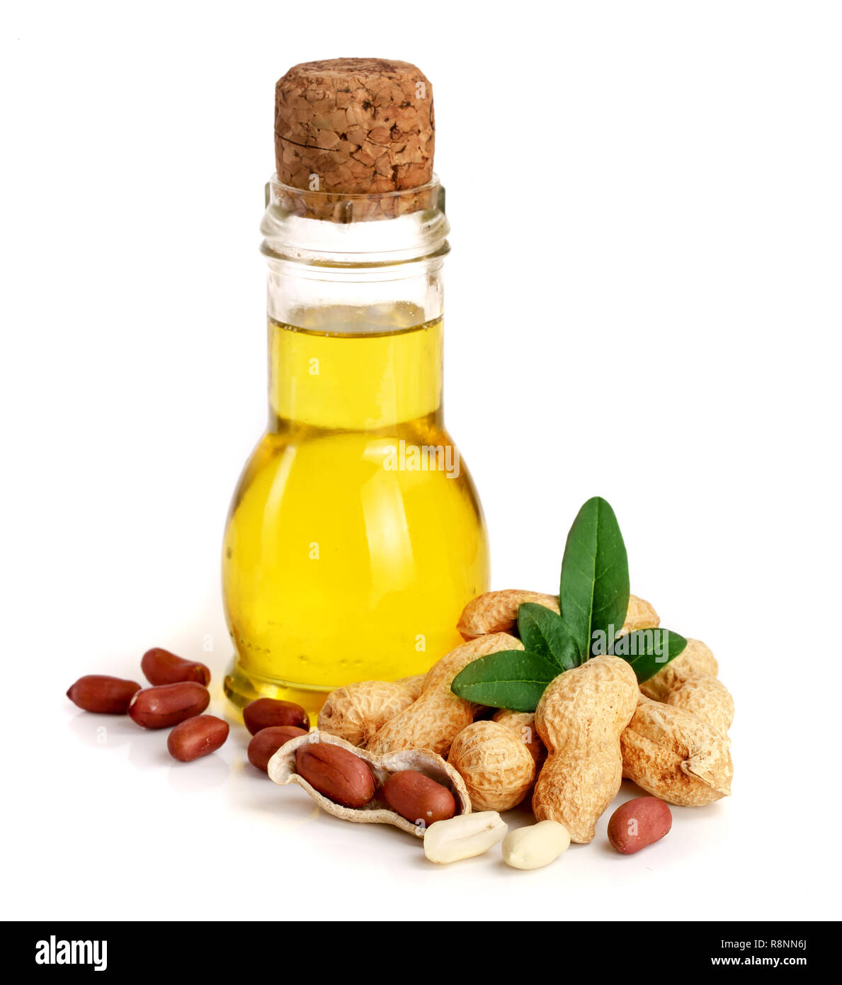peanut oil in a glass bottle with peanuts Stock Photo Alamy