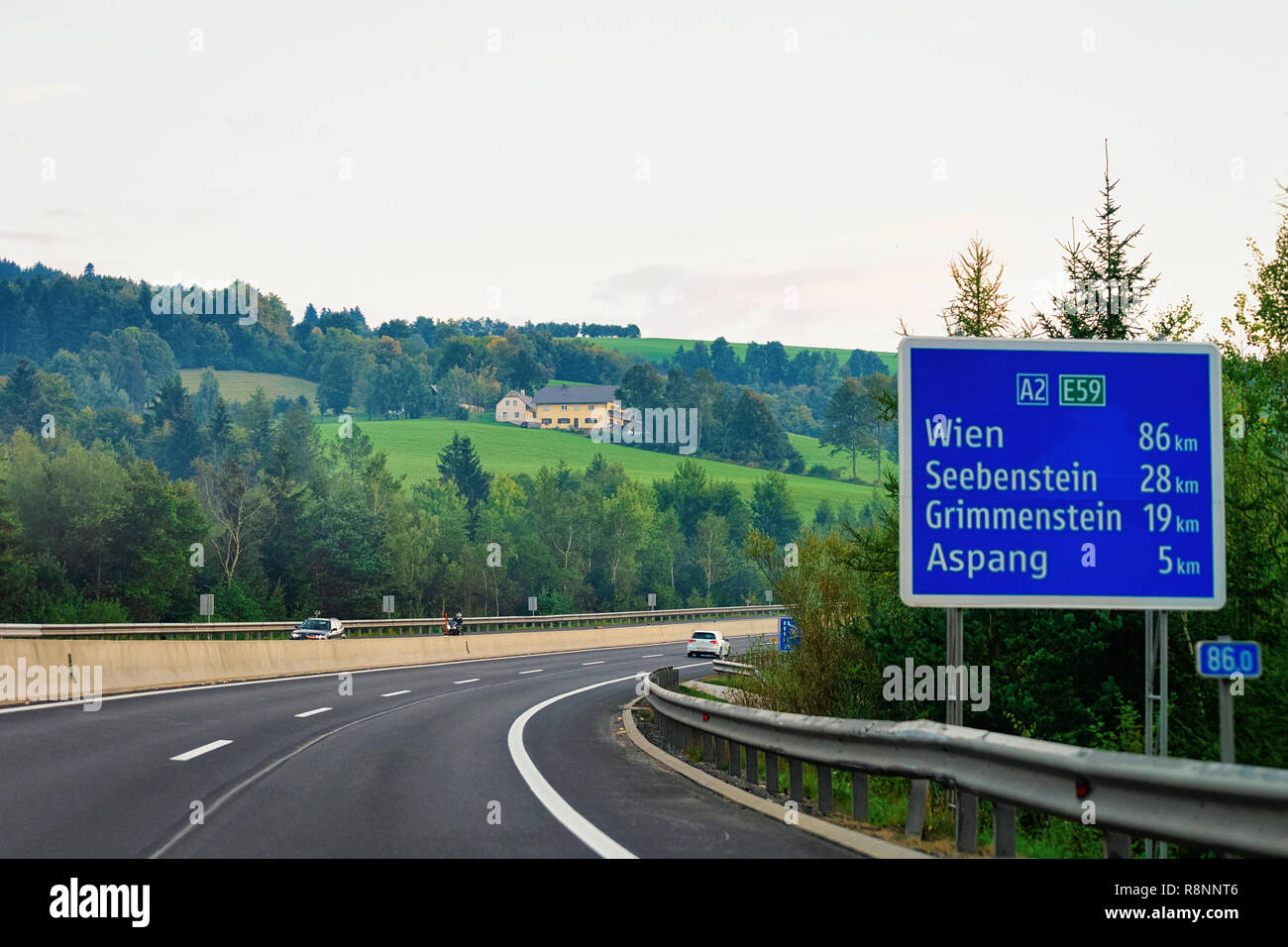 Wien, Austria - September 17, 2018: Sign board in the road of Austria. Julian Alps on the background. Stock Photo