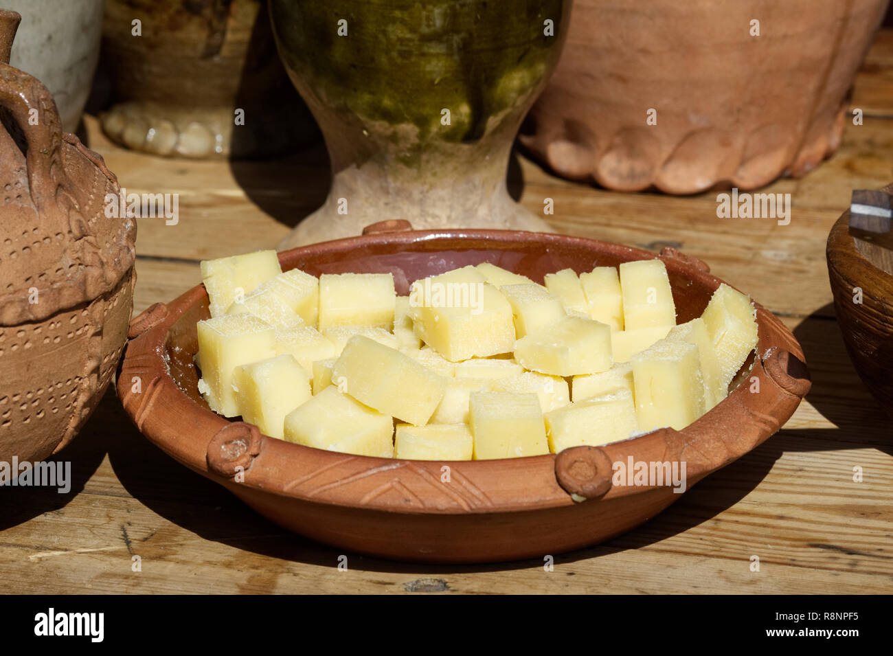 Medieval banquet cheese in a bowl. Stock Photo