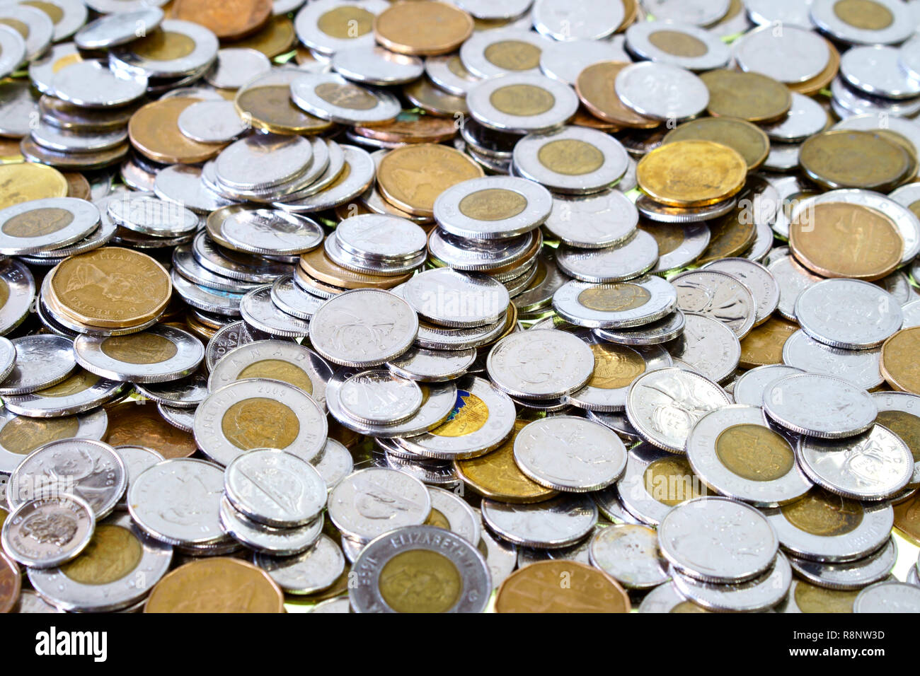 Montreal, Quebec, Canada / Dec, 16th 2018 : Spare change of canadian metal money spread and filling the frame.. Nickel,dime, quarter,one, two dollar m Stock Photo