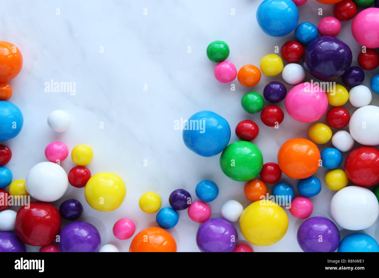 Bubble gum balls frame open white copy space. Stock Photo