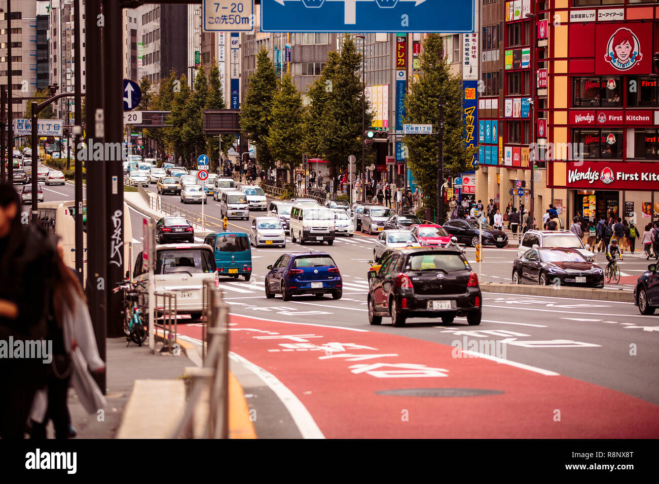 A busy street scene in the Shinjuku area of Tokyo, Japan Stock Photo
