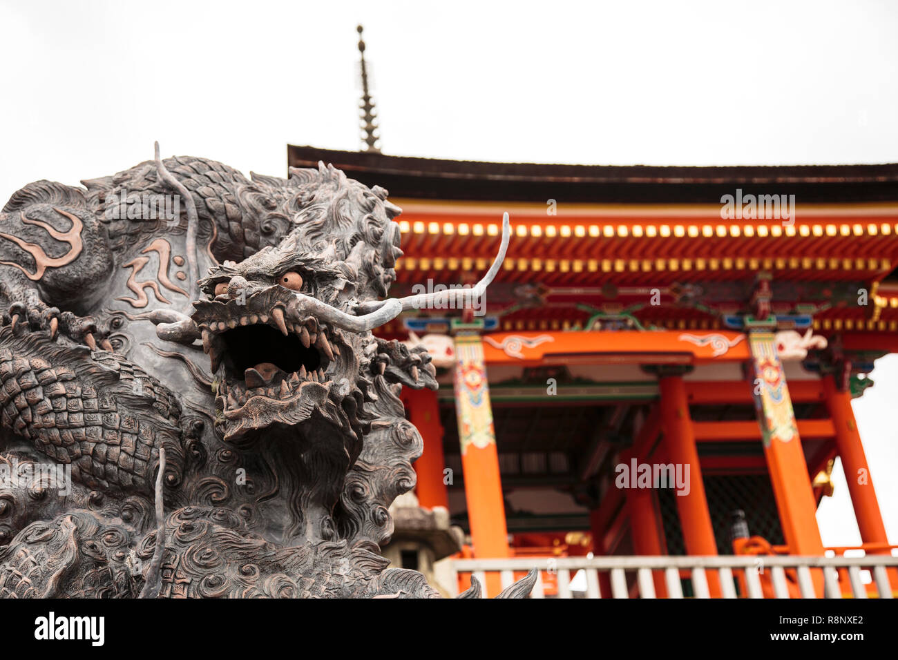 Imposing dragon sculpture on the steps of a gate at Kiyomizu-dera temple in Kyoto. Stock Photo