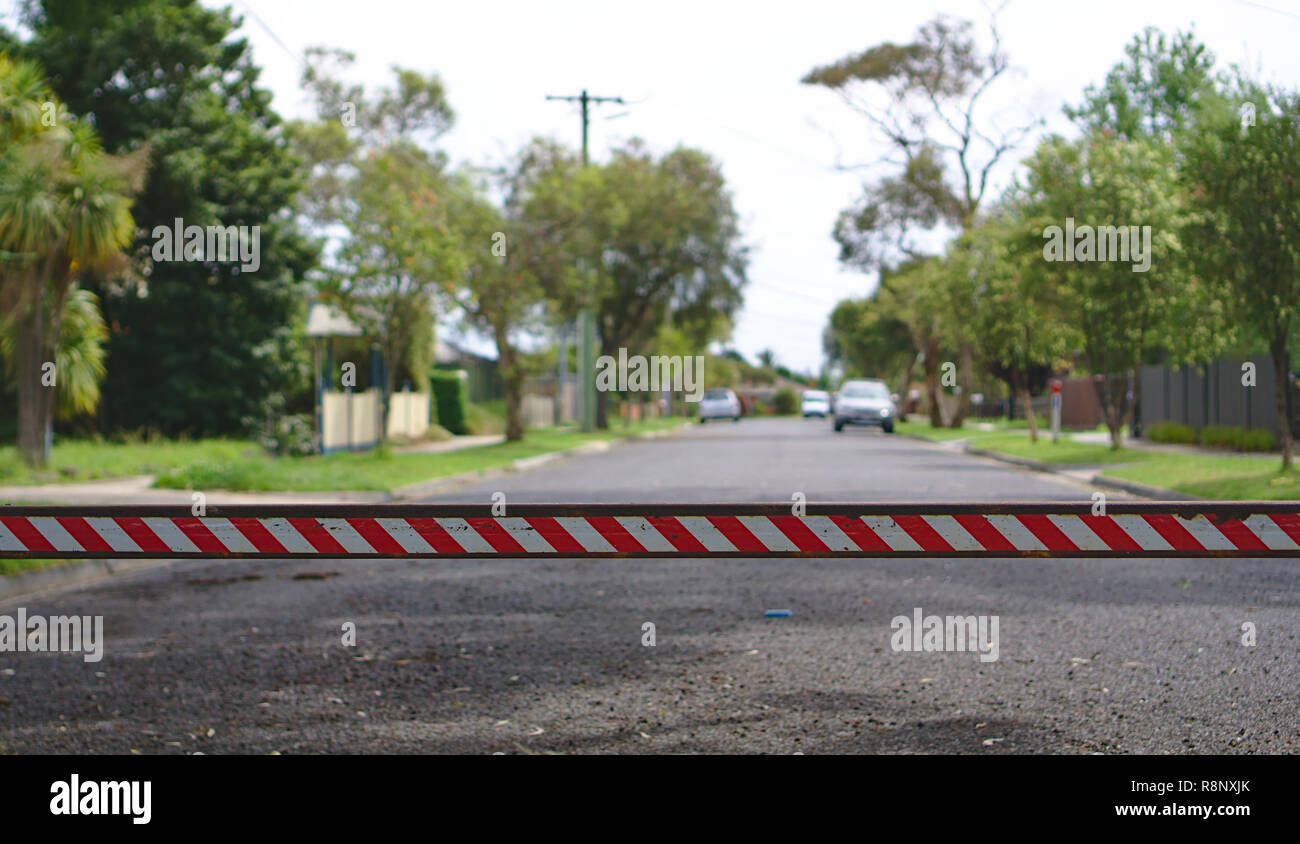 Close up view of red white stripes bar closing road Stock Photo