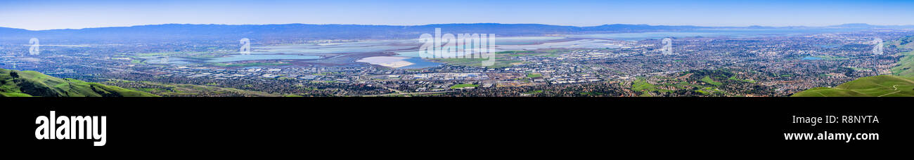Panorama view of the cities on the shoreline of south and east San Francisco bay area; colorful salt ponds in the background; Silicon Valley, Californ Stock Photo