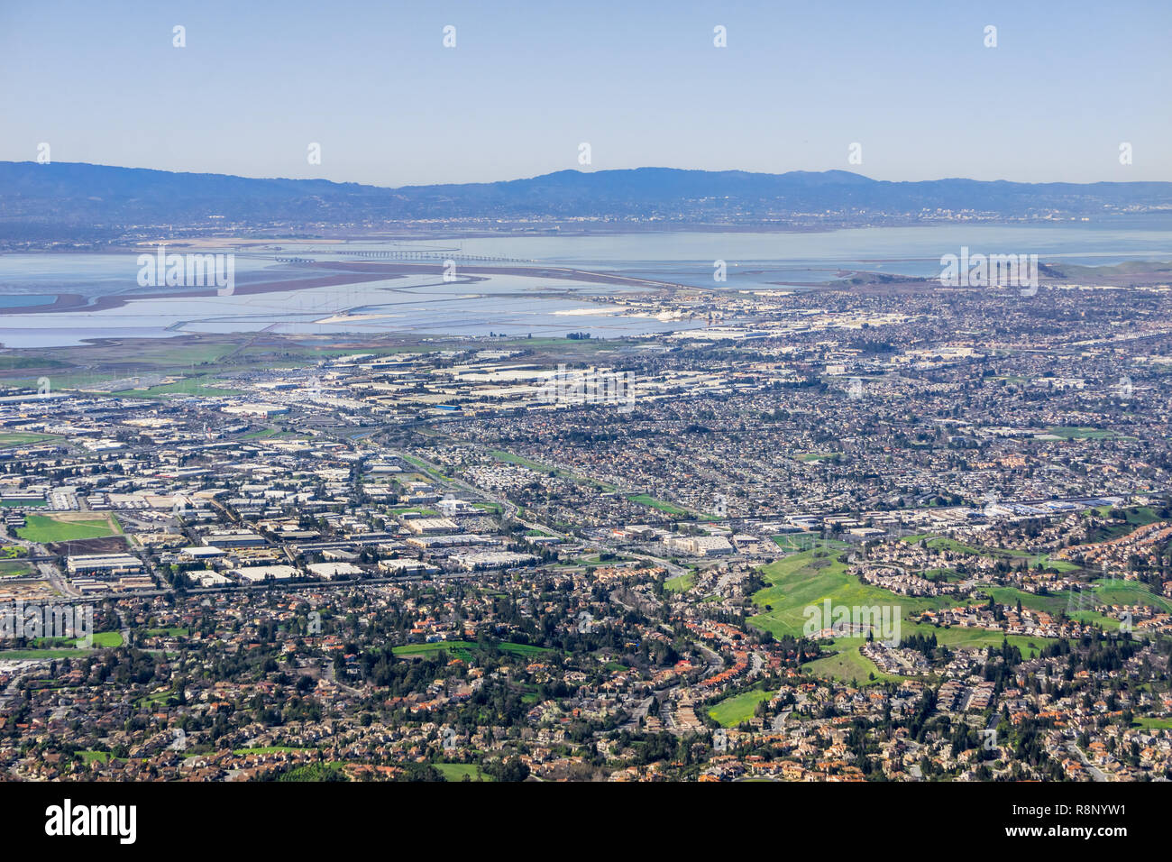 Aerial view of Fremont and Newark on the shoreline of east San Francisco bay area; Dumbarton bridge in the background; Silicon Valley, California Stock Photo