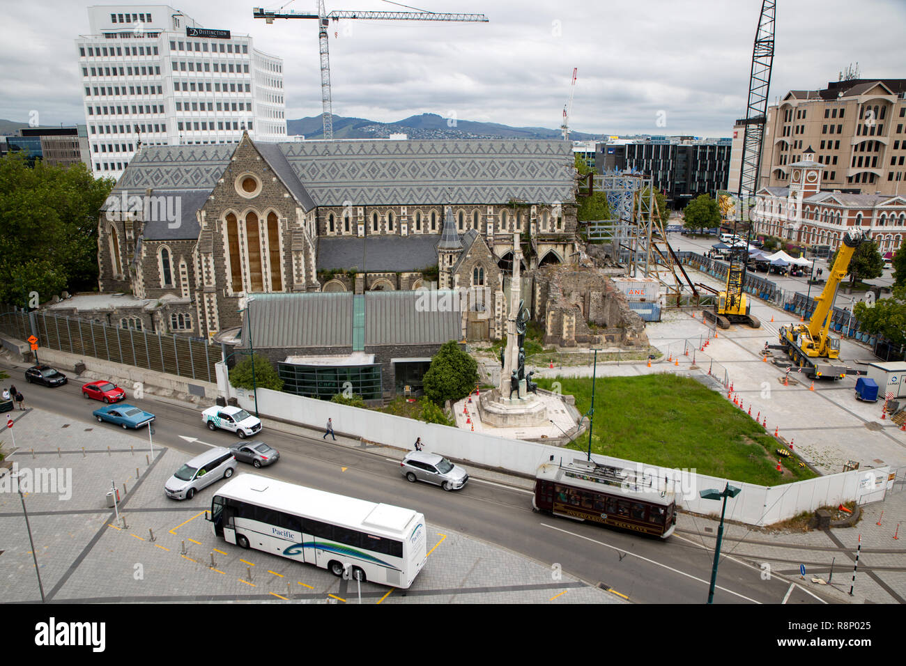 Christchurch, New Zealand - December 16 2018: Construction cranes around the Christchurch Cathedral are ready to dismantle it for repair and restorati Stock Photo