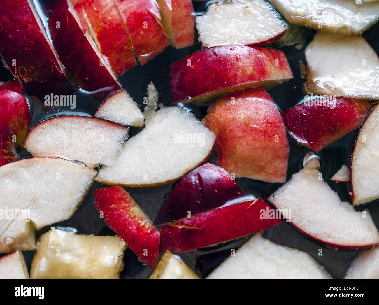 Colorful Apple Slices, Mixed Fruits In A Pot.  Refreshing Fruit Apple Cider Punch Party Drink. Organic Food And Beverage Background. Stock Photo