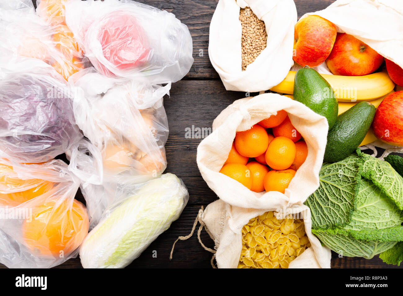 Fresh vegetables and fruits in eco cotton bags against vegetables in