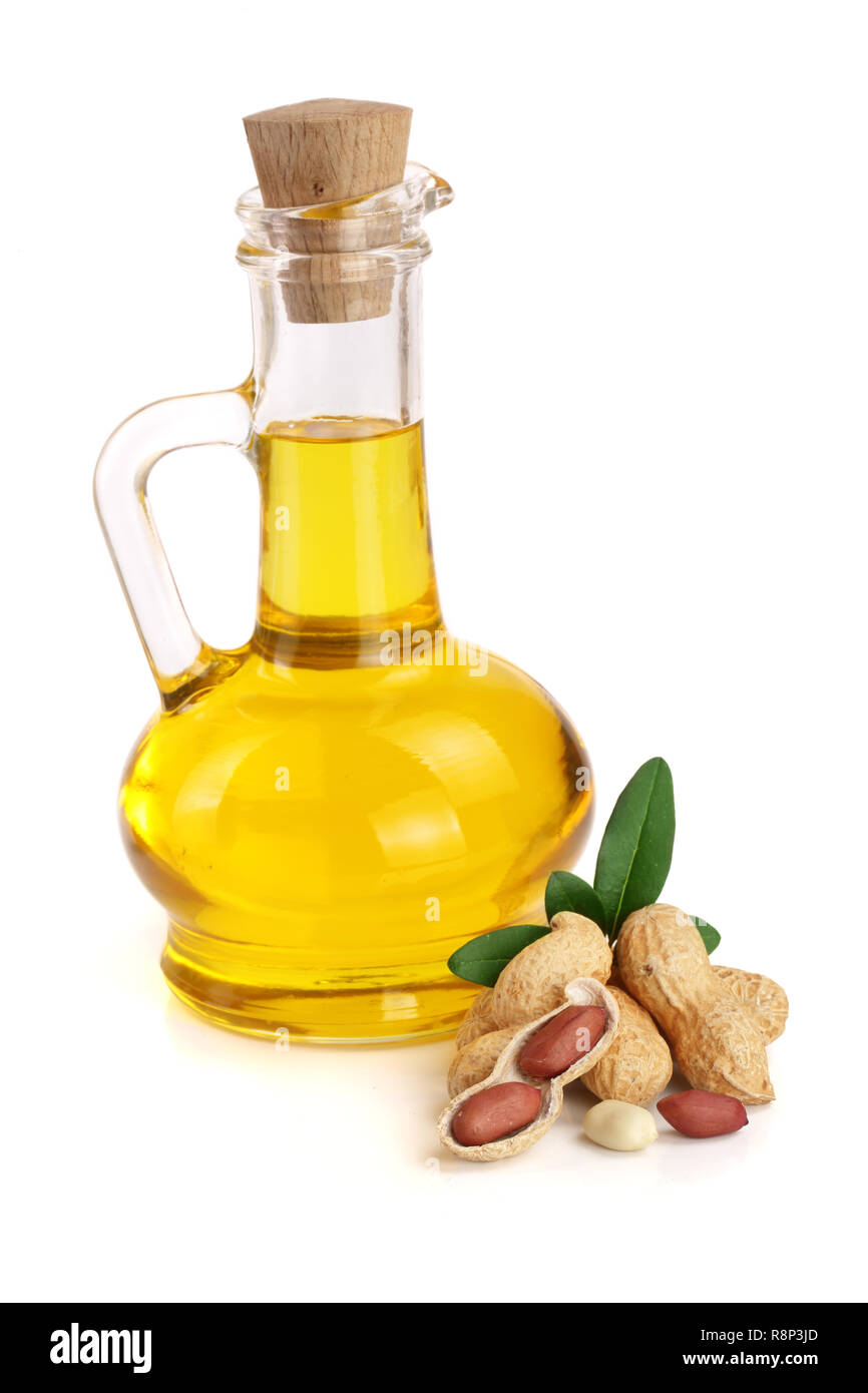 peanut oil in a glass bottle with peanuts Stock Photo Alamy