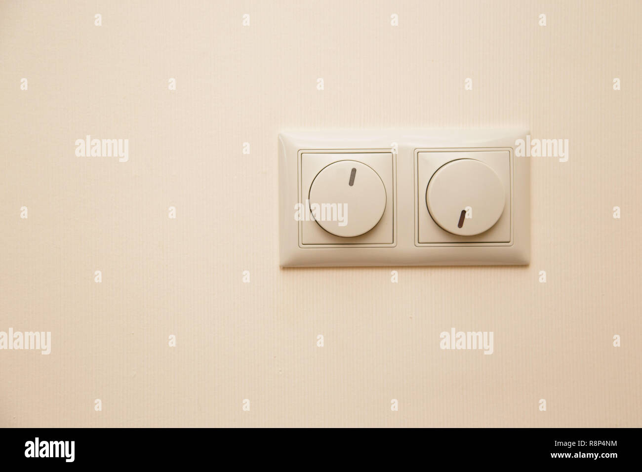 Electrical light dimmer switches on the wall Stock Photo Alamy