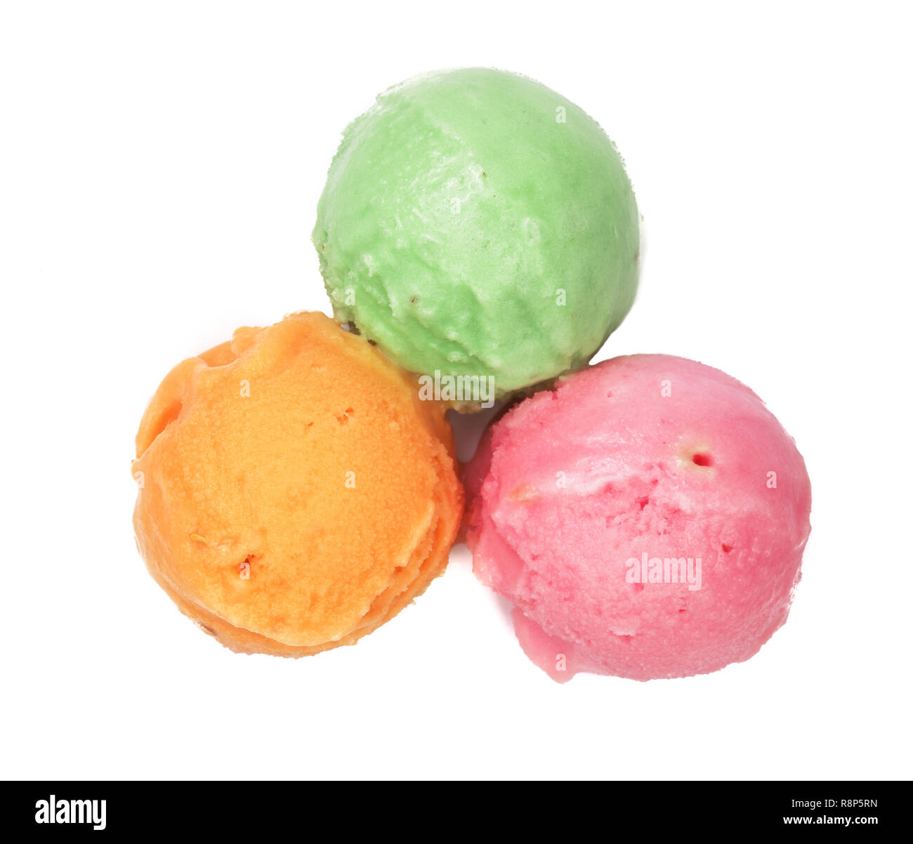 Green red and yellow ice cream ball isolated on white background, top view Stock Photo