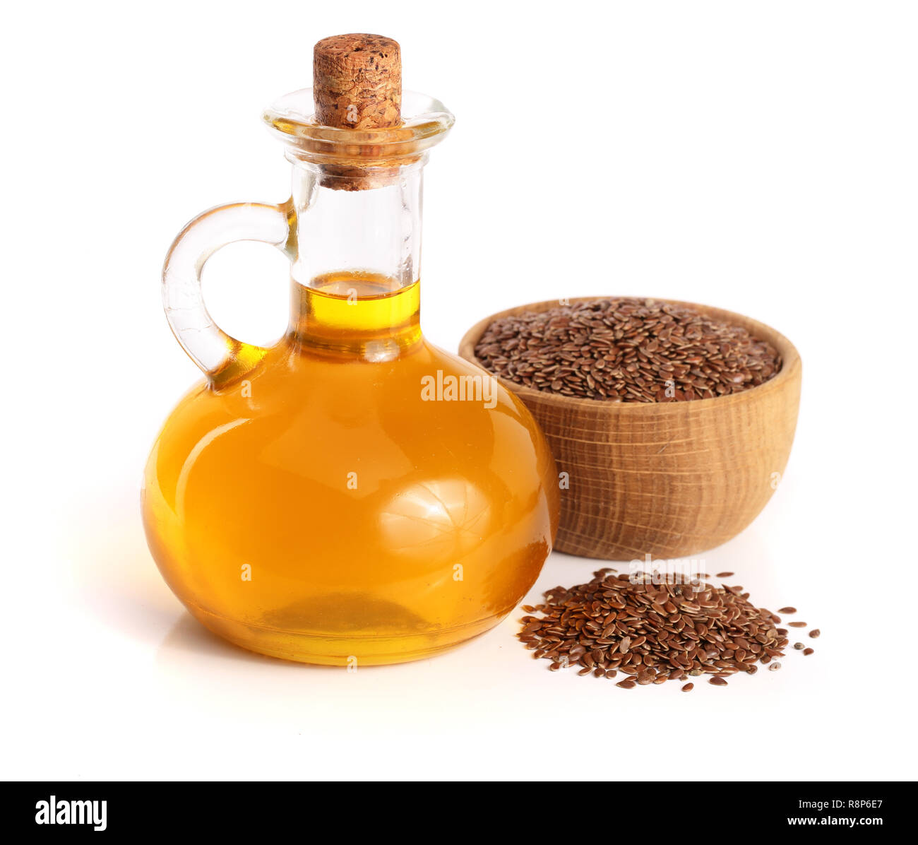 linseed oil with flax seeds isolated on white background Stock Photo ...
