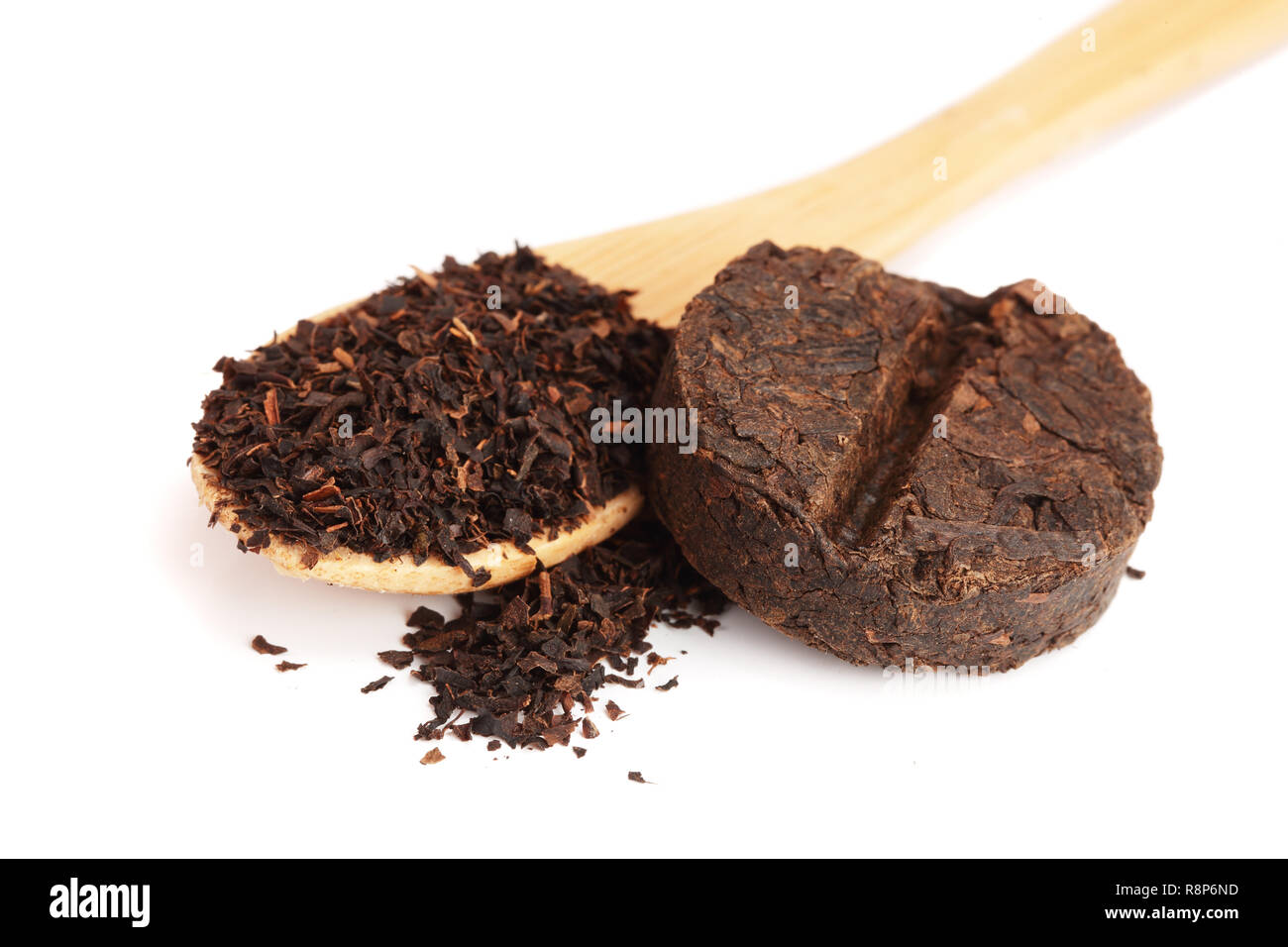Round flat disc of puer tea isolated on white background. Pressed ...