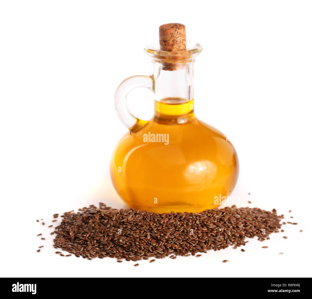linseed oil with flax seeds isolated on white background Stock Photo ...