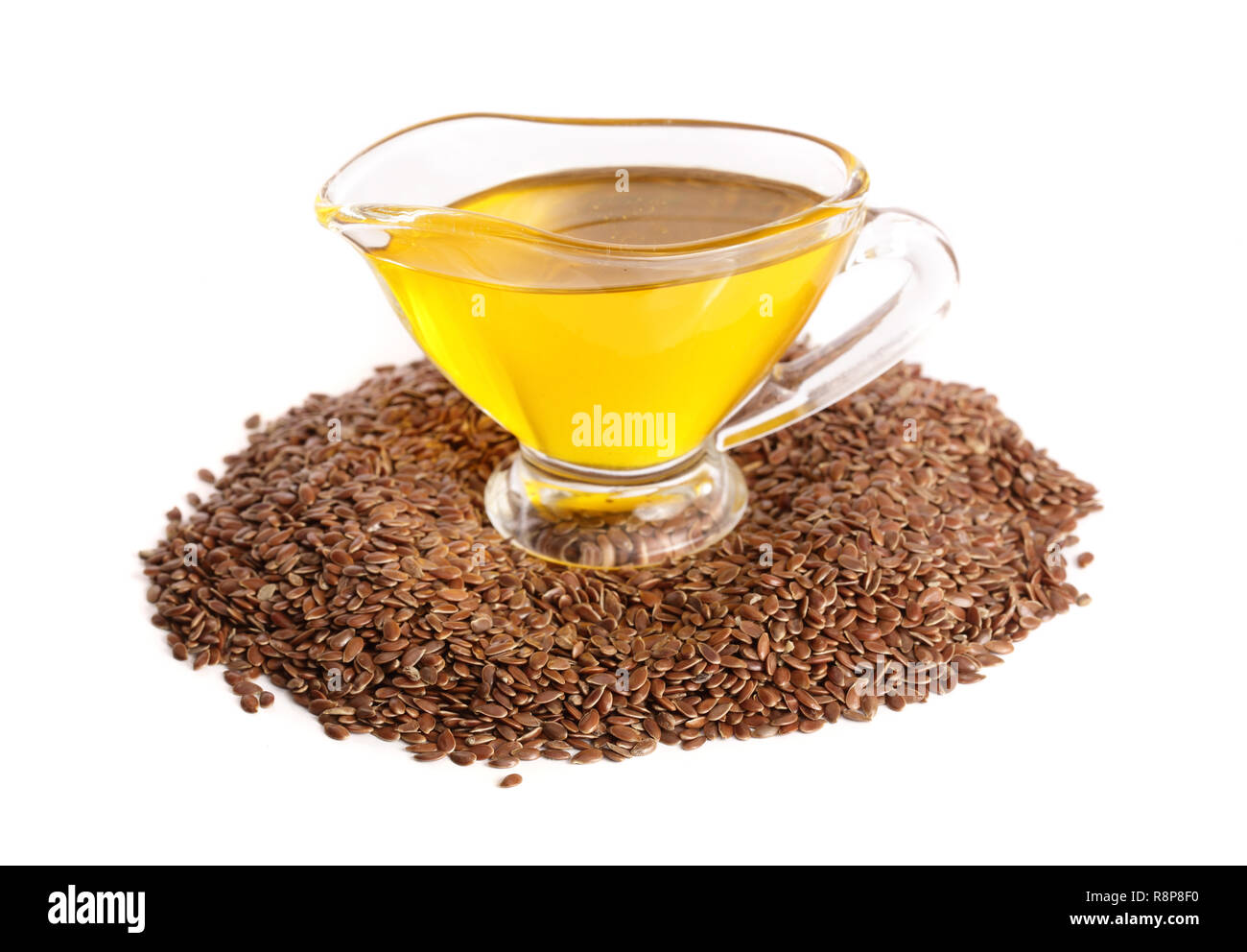 linseed oil with flax seeds isolated on white background Stock Photo ...