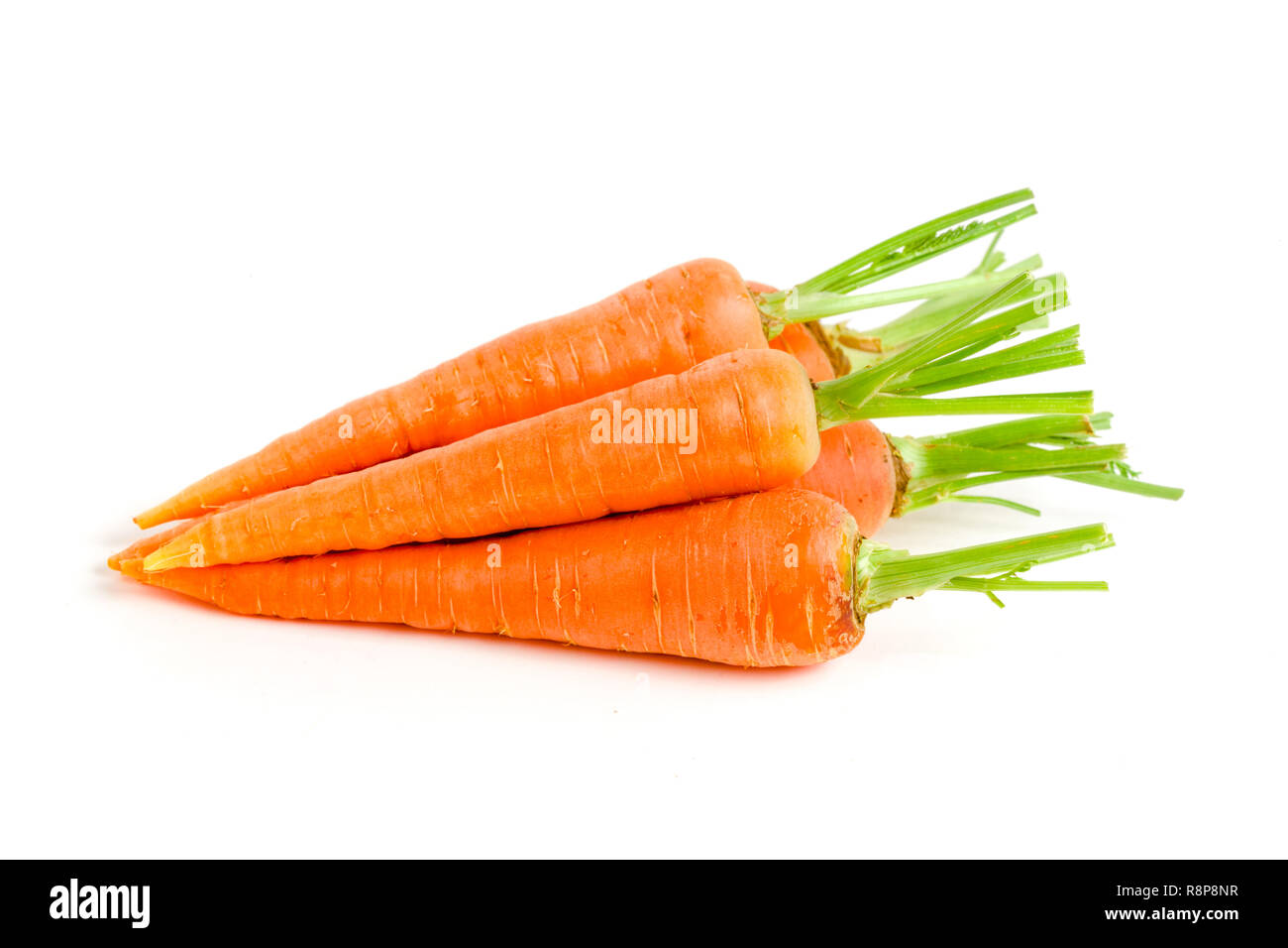Carrot vegetable with leaves isolated on white background Stock Photo -  Alamy