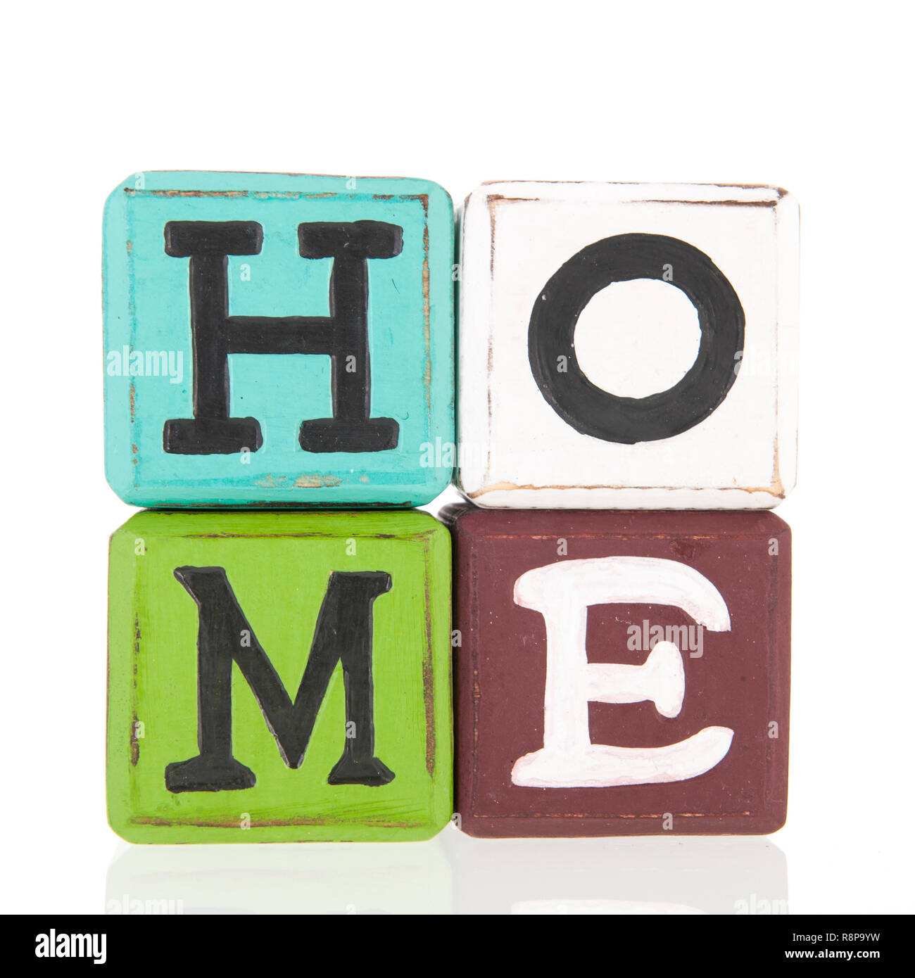 Colorful wooden blocks with home text isolated over white background ...