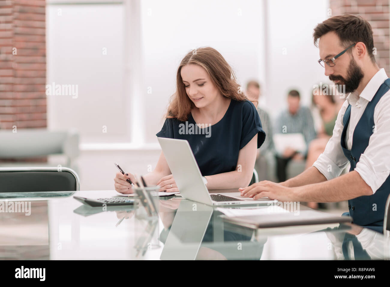 Two successful employees sitting hi-res stock photography and images ...