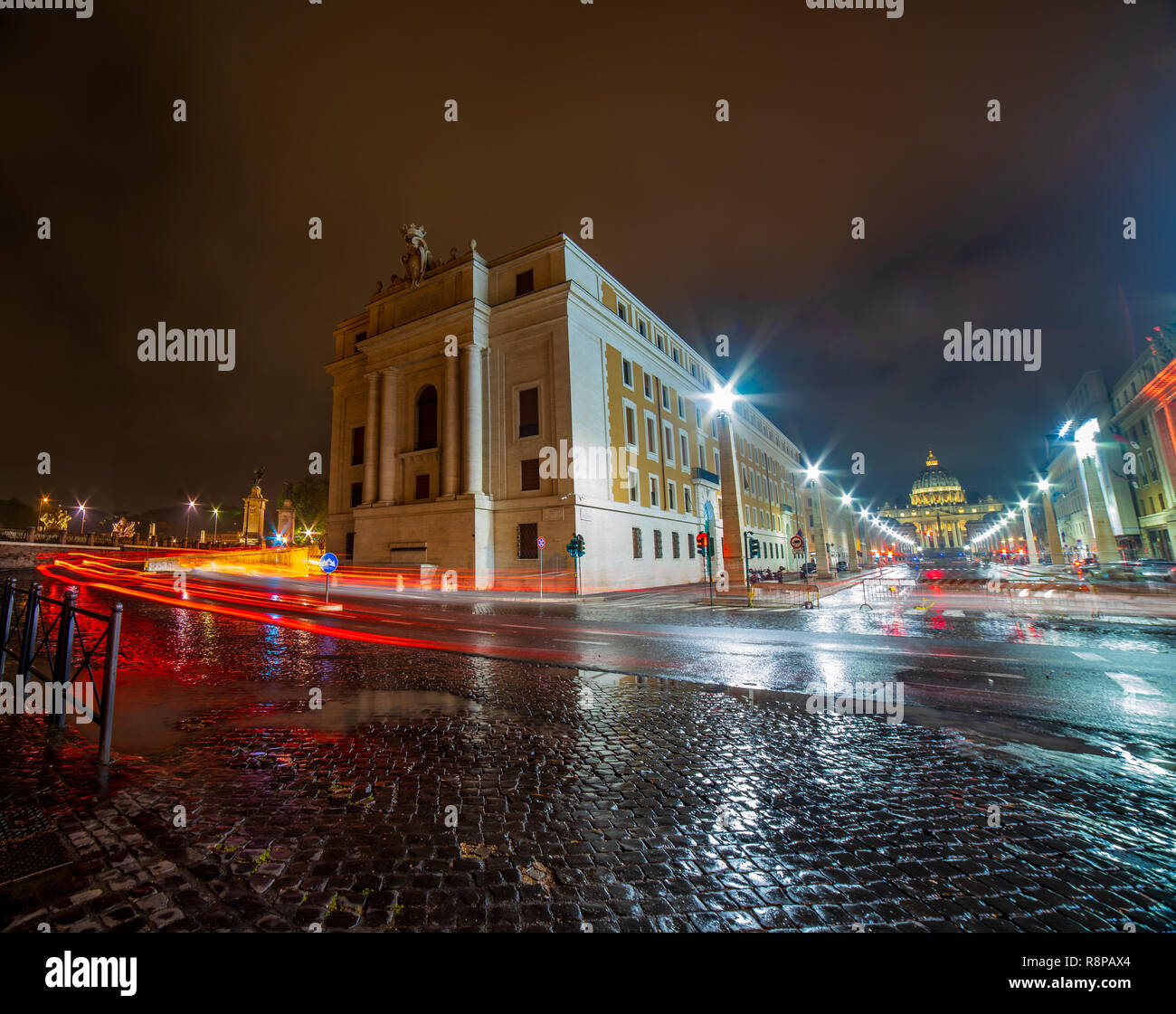 ROME,ITALY - JUNE 2018:  Piazza San Pietro and the Basilica of San Pietro during a cloudy and rainy Roman night. Rome at night. Stock Photo