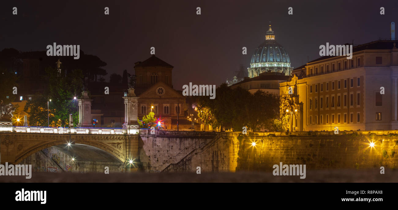 ROME,ITALY - JUNE 2018:  Piazza San Pietro and the Basilica of San Pietro during a cloudy and rainy Roman night. Rome at night. Stock Photo