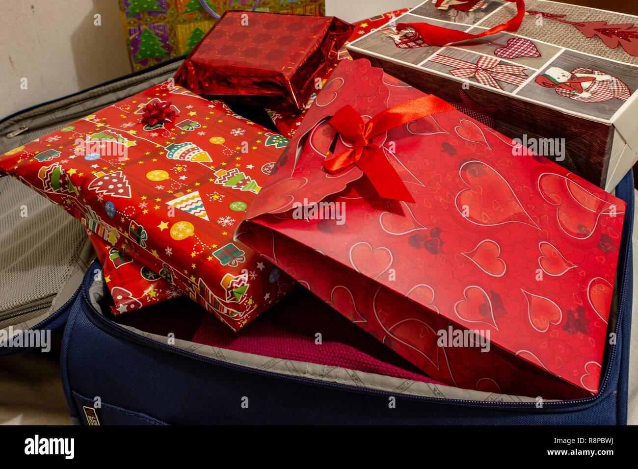 Return to the family home for the Christmas holidays, with a suitcase full of presents. Stock Photo