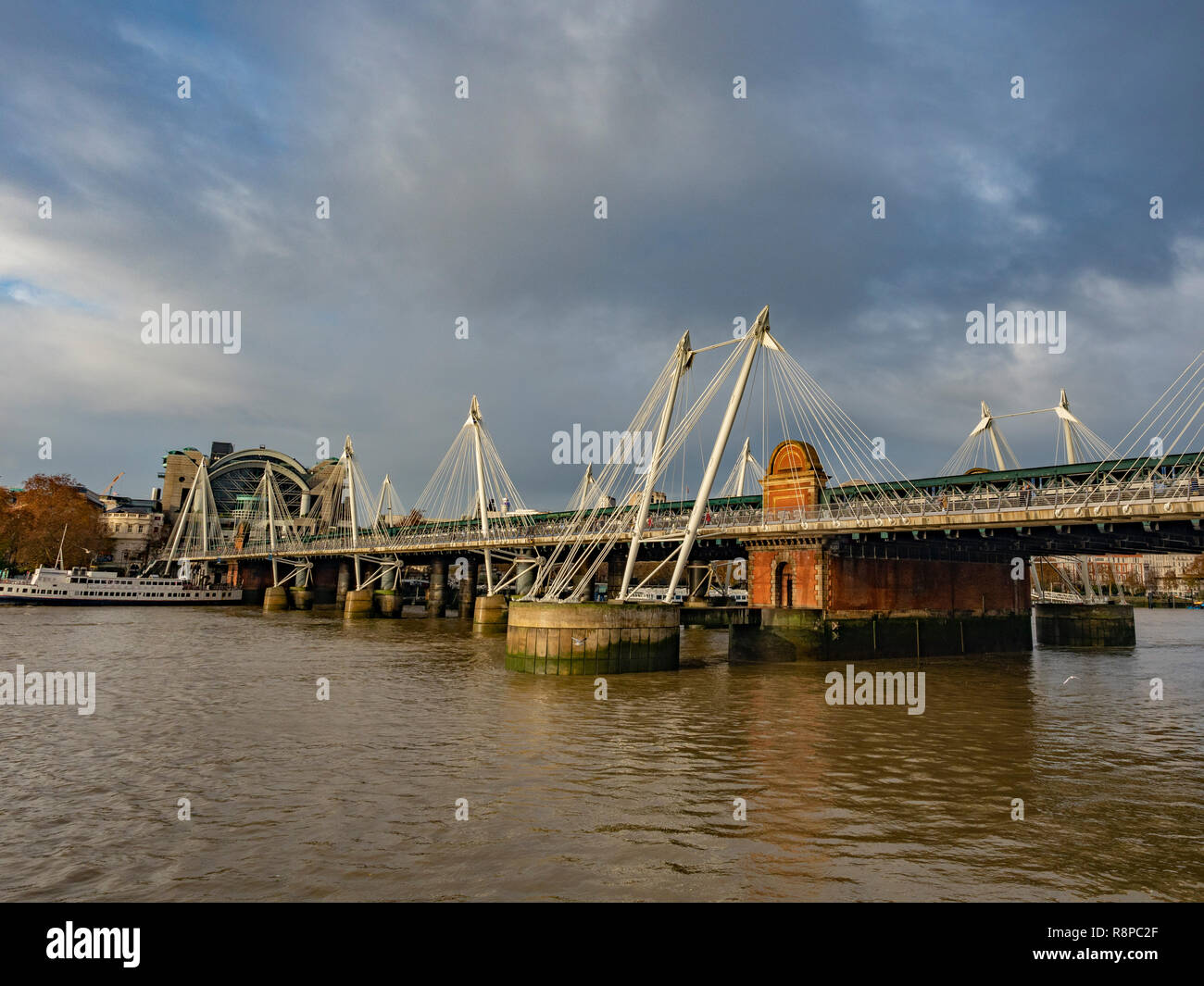 Hungerford Bridge and Golden Jubilee Bridges over the river Thames, London, UK. Stock Photo