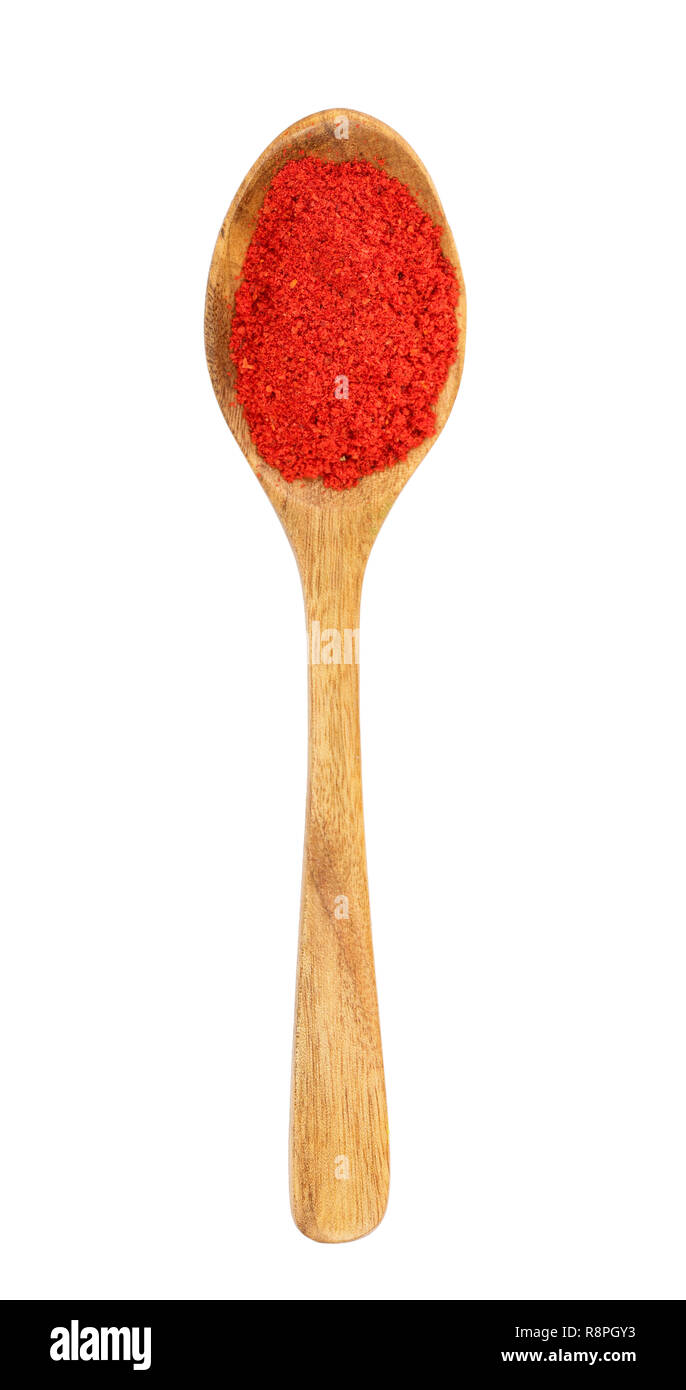 sweet paprika spice in a wooden spoon isolated on white background. Top view. Flat lay Stock Photo