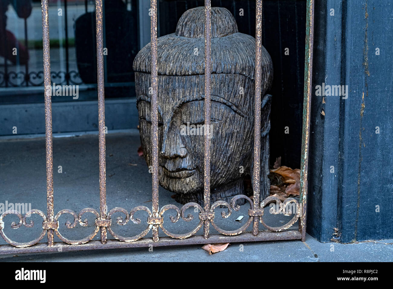 Buddha behind bars Stock Photo
