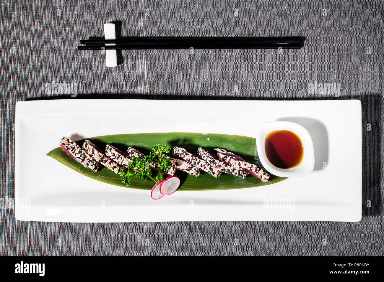 bluefin tuna tataki marinated with spices, breaded with sesame served