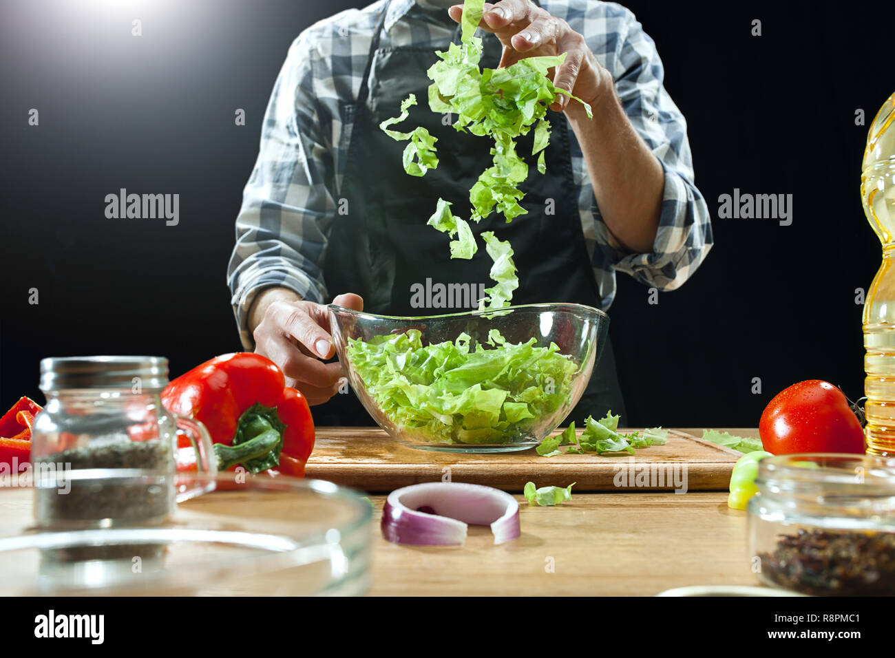 Woman cutting vegetables in the kitchen. Cooking healthy diet food concept  Stock Photo - Alamy