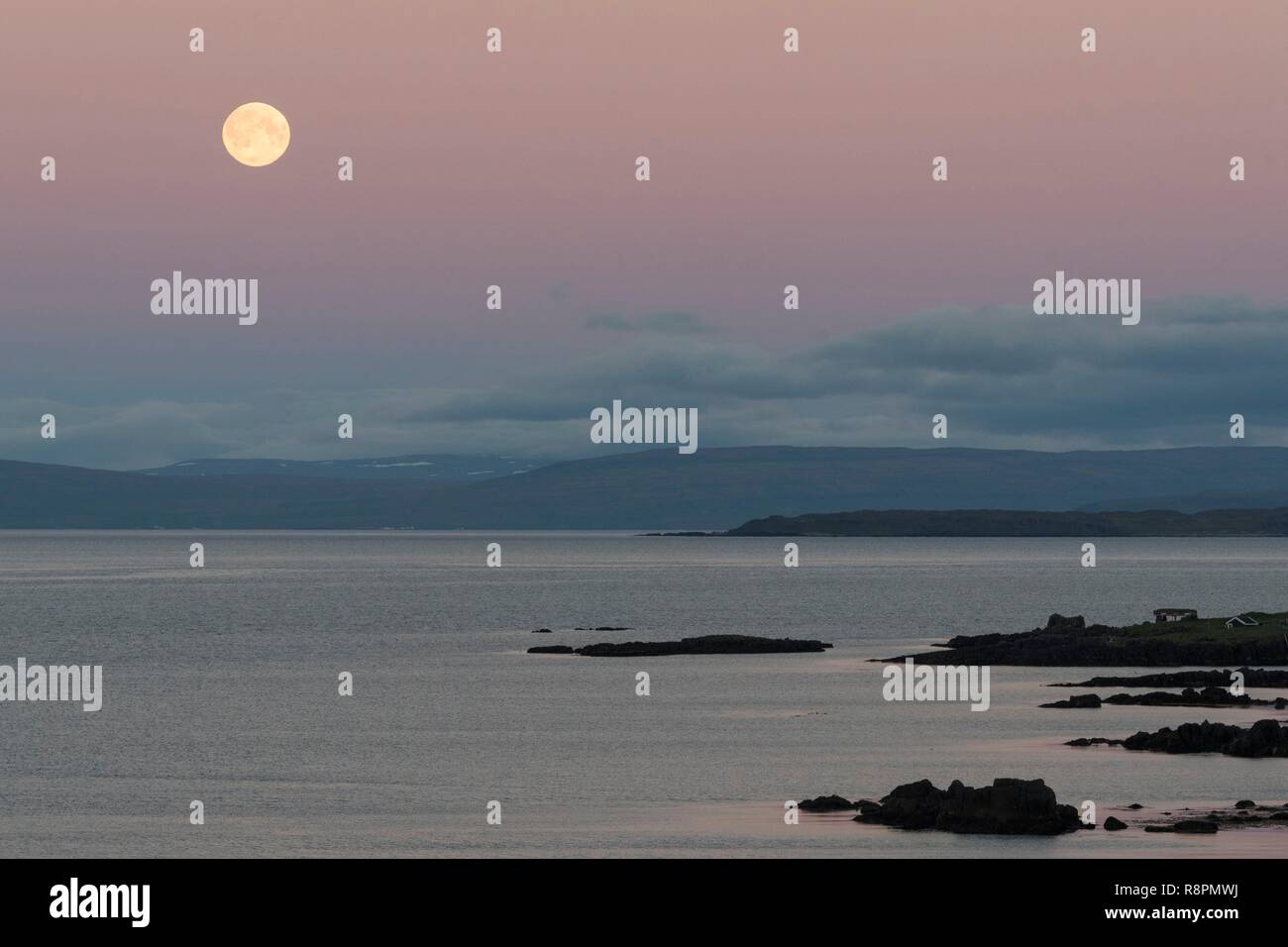 Iceland, Westfjords, Vestfirdir Region, full moon and midnight sun Stock Photo