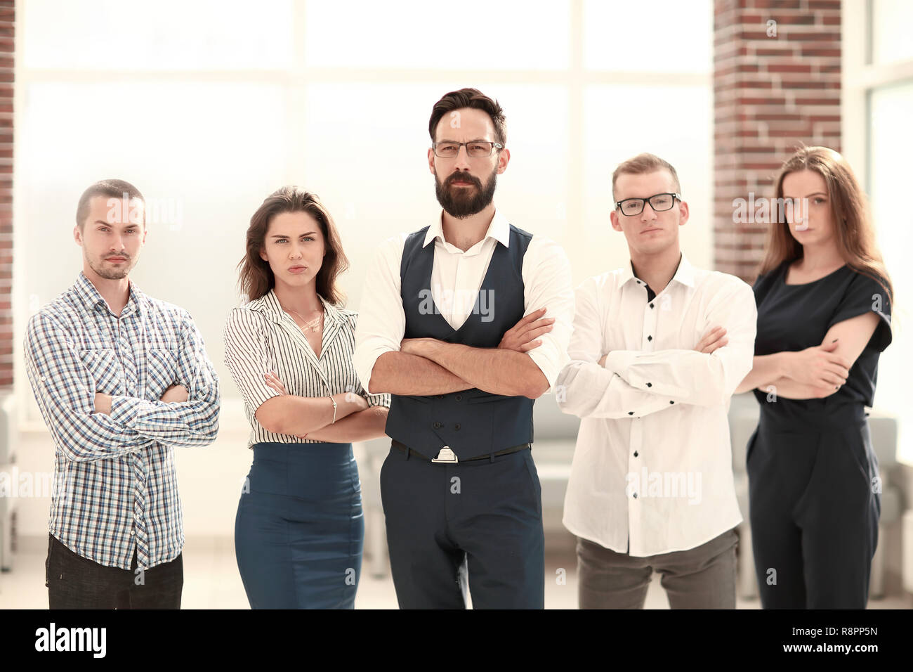confident business team standing in a modern office Stock Photo - Alamy