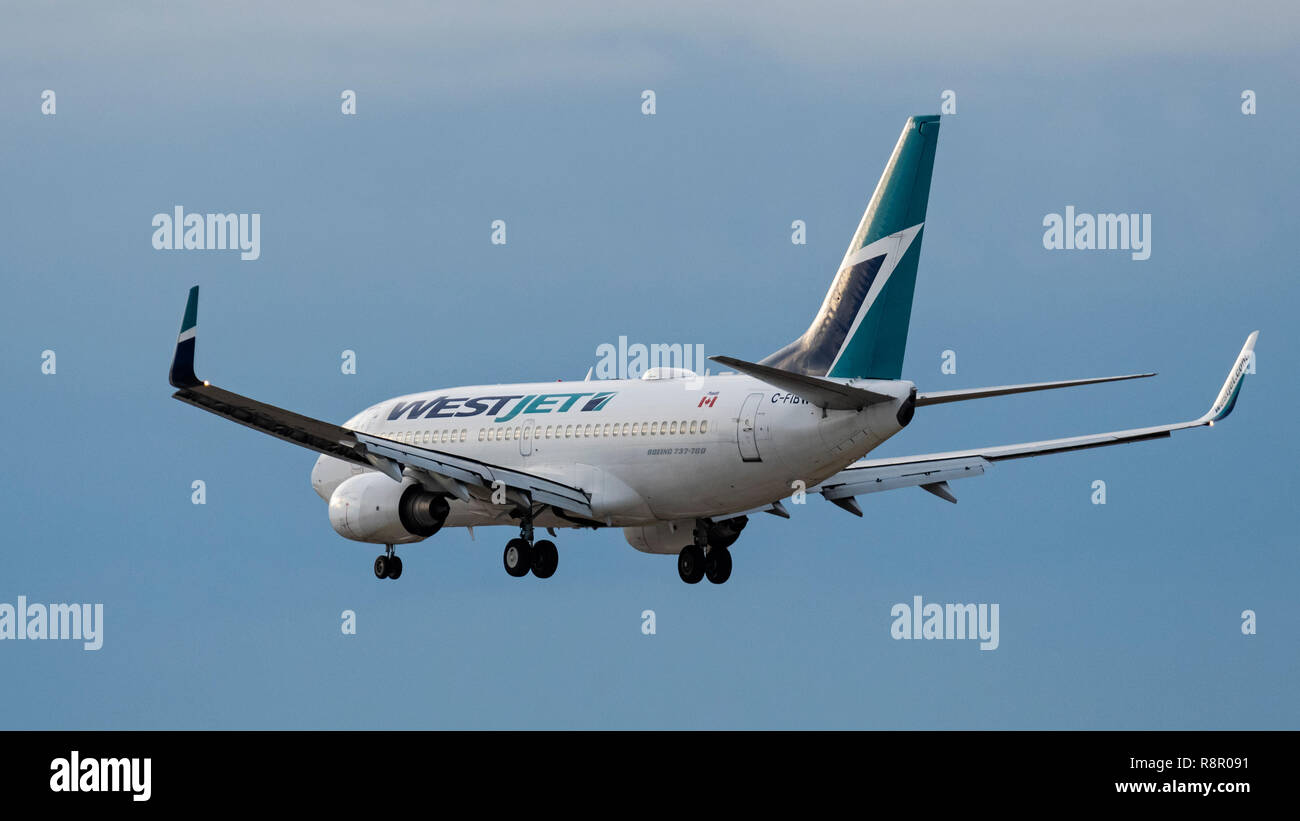 WestJet Airlines plane Boeing 737 jet airliner airplane final approach landing Stock Photo