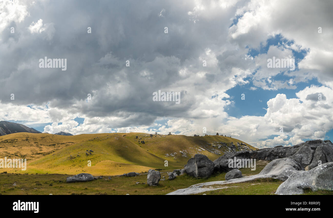Giant limestone boulders and dramatic cloudy sky, Castle Hill, South Island New Zealand Stock Photo