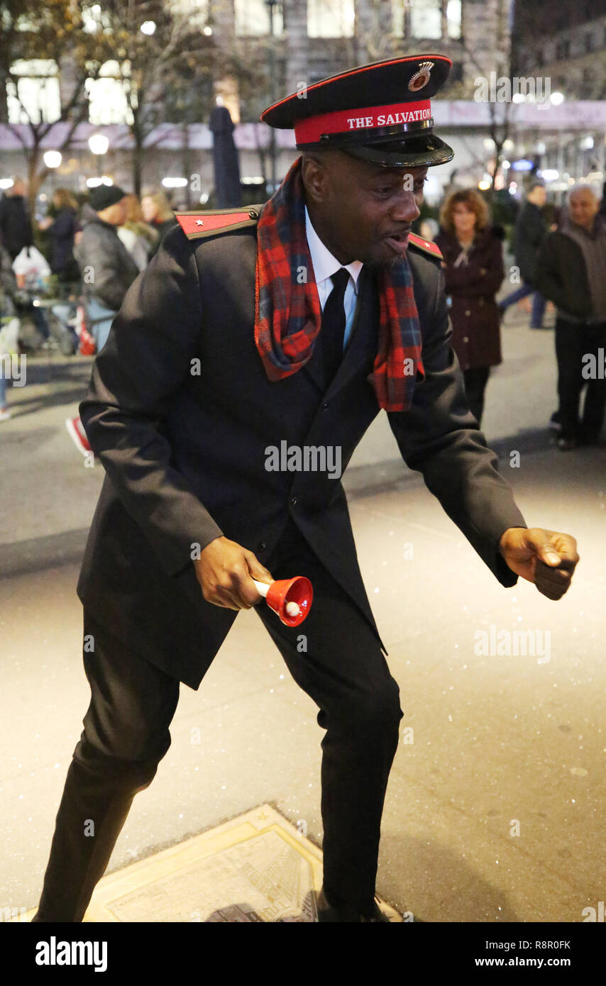 Salvation Army soldier performs for collections in midtown Manhattan Stock Photo