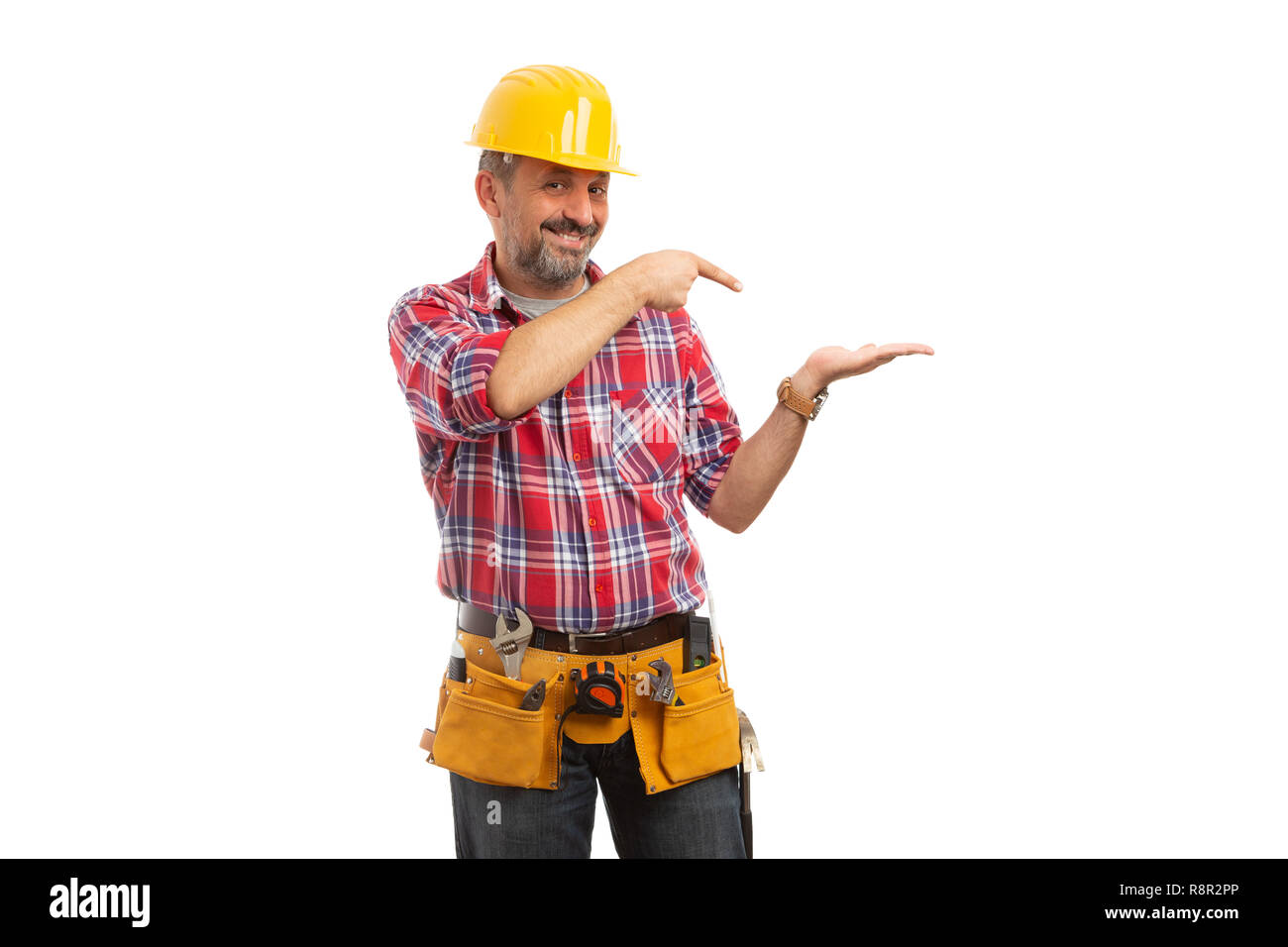 Builder with trustworthy expression presenting blank copyspace in palm isolated on white studio background Stock Photo
