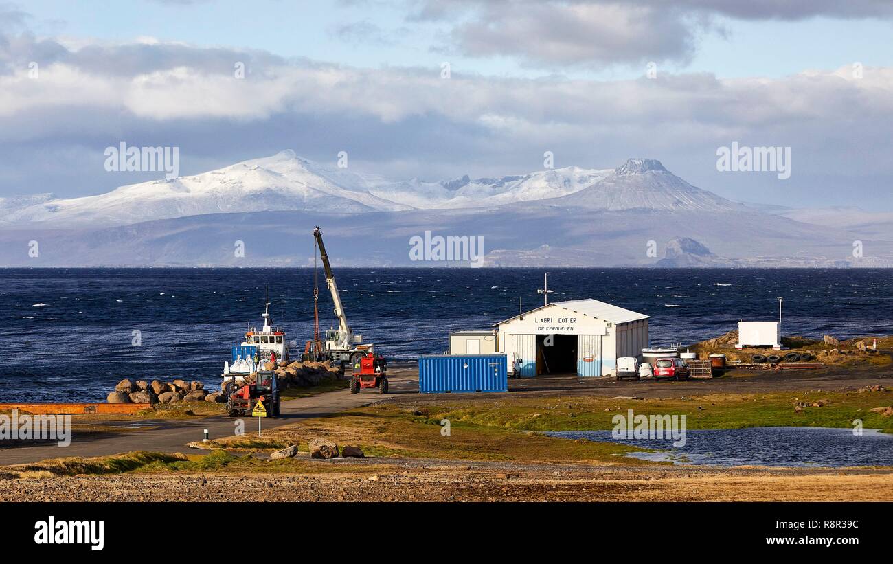 France, French Southern and Antarctic Lands, Kerguelen Islands, Port-aux- Français, the landing pier ad his building with the mounts of the peninsula  of Ronac'h in the background Stock Photo - Alamy