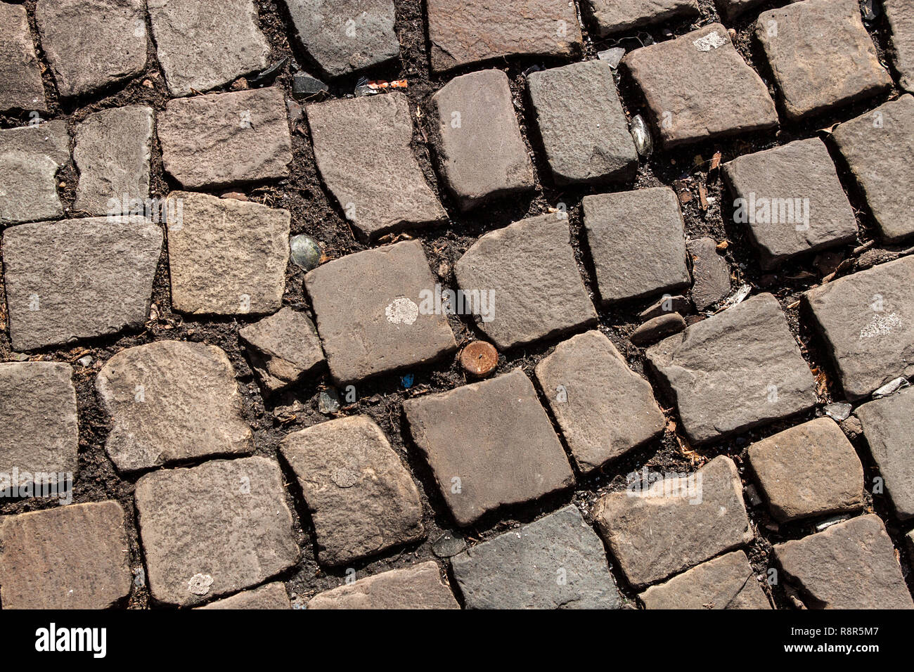 Abstract background of old cobblestone pavement close-up Stock Photo ...