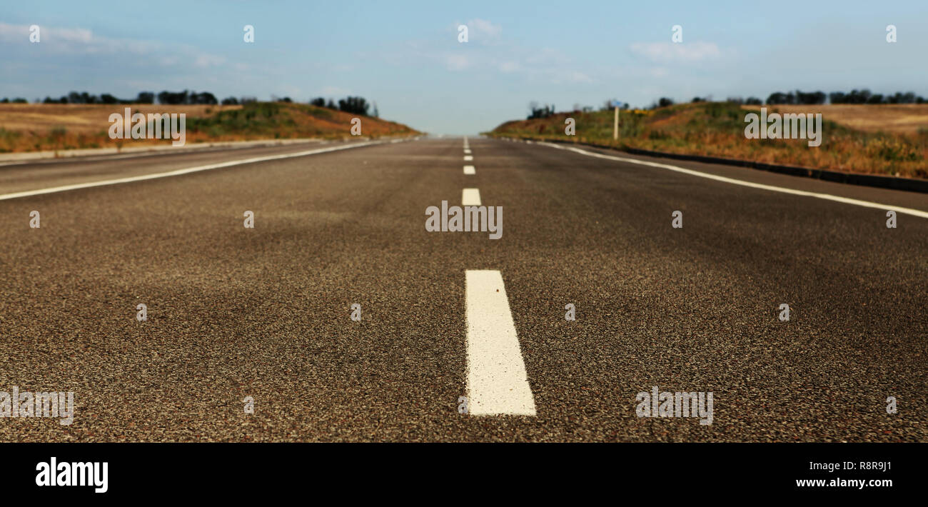 Asphalt road through the field hi-res stock photography and images - Alamy