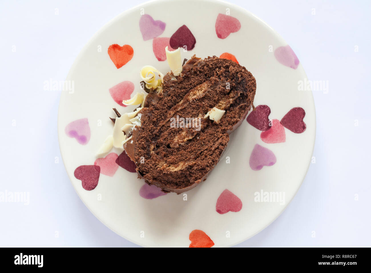 Slice of M&S Yuletide Log on plate - from above looking down on Stock Photo