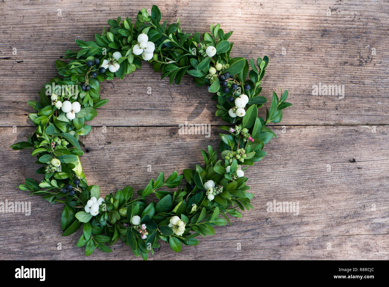 Little wreath on wooden background Stock Photo