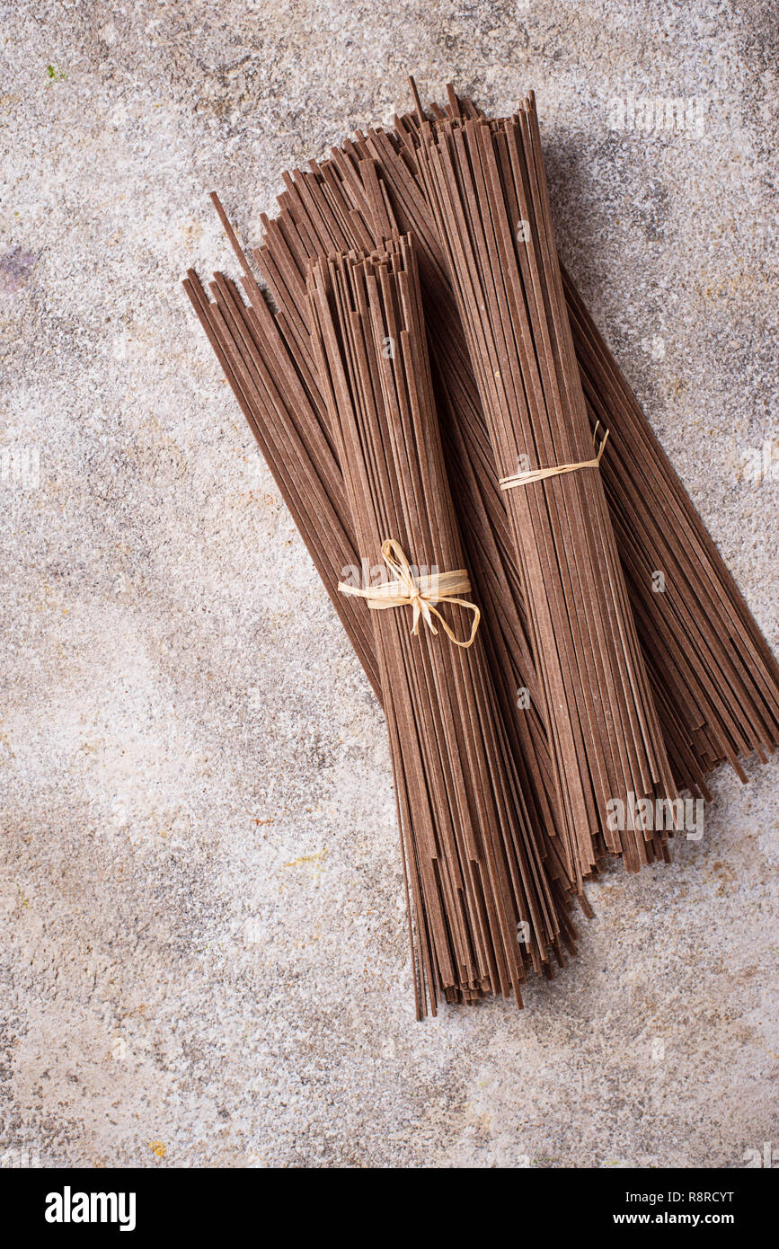Raw uncooked Japanese soba noodles on light bacground Stock Photo Alamy