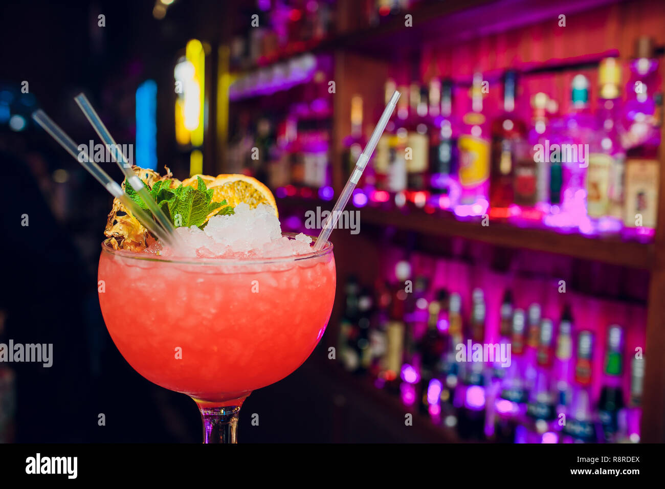 Glasses cocktails bar background Stock Photo - Alamy