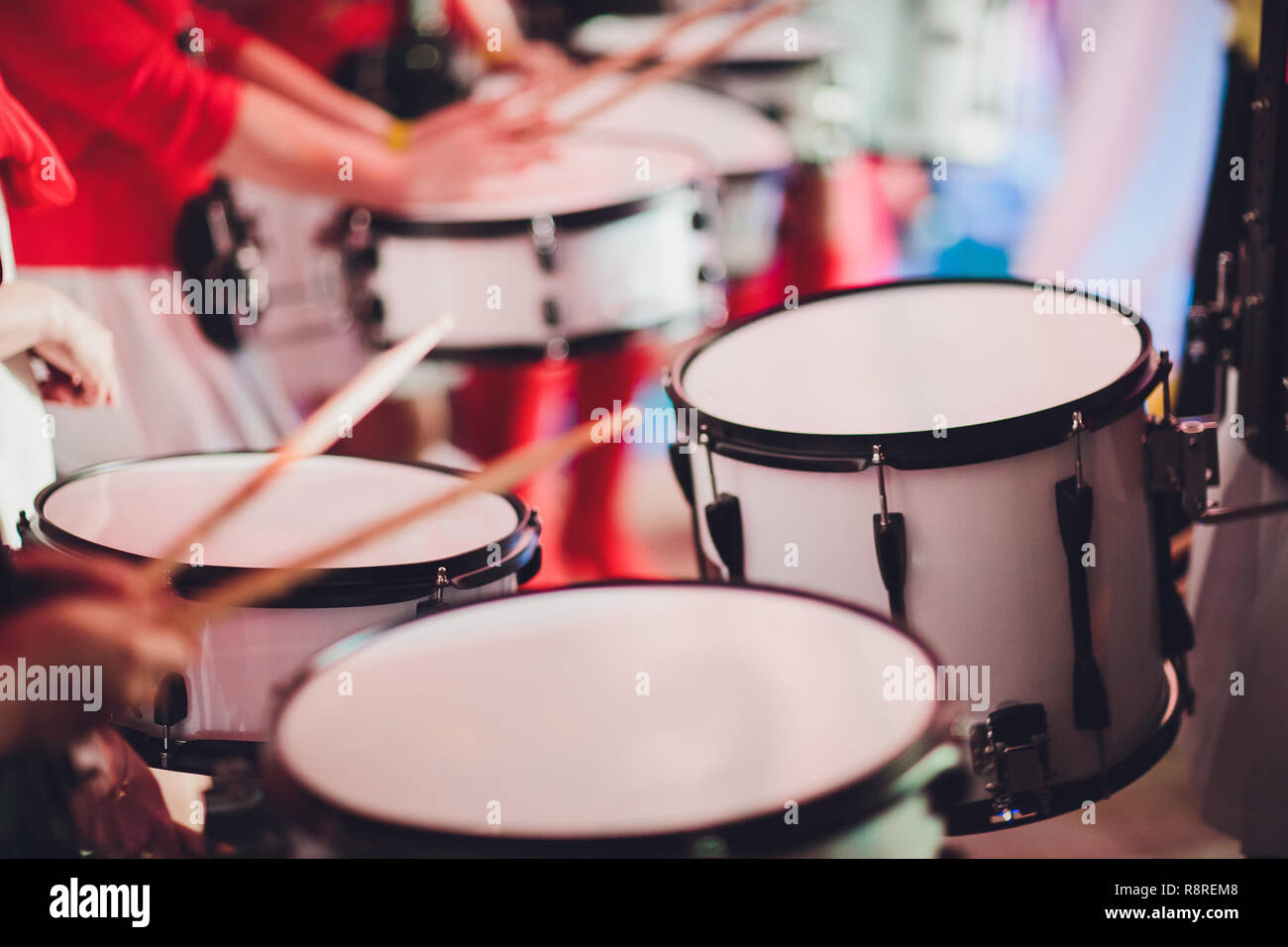 drummer plays with drumsticks on rock drum set Stock Photo Alamy