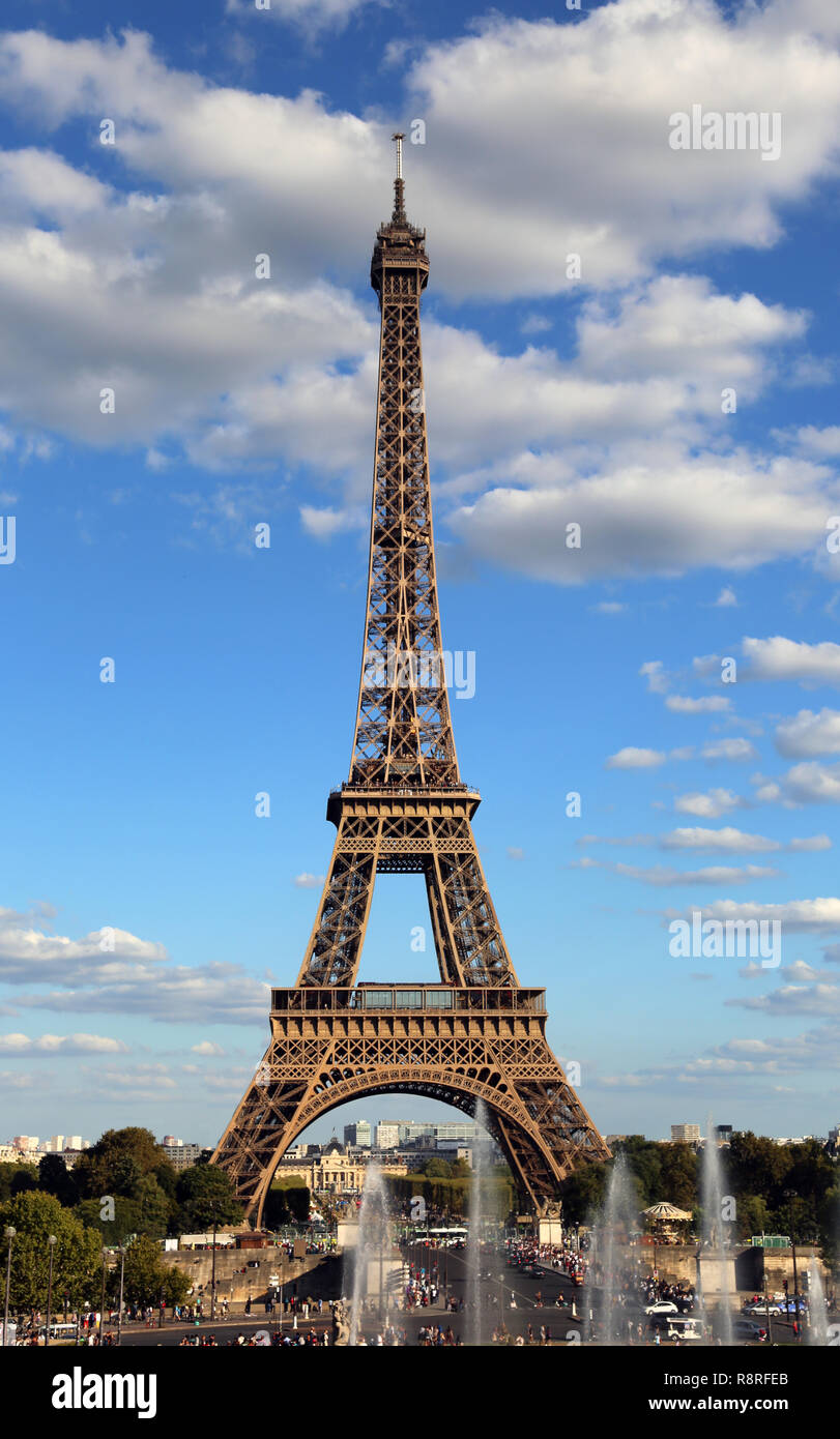 Eiffel Tower symbol of in Paris city in France with clouds seen from Trocadero Area with fountain Stock Photo