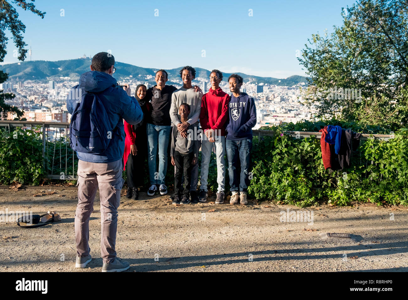 Barcelona, Spain - 24 november 2018: group of young smiling african american friends and family pose for a picture during holidays trip in europe Stock Photo
