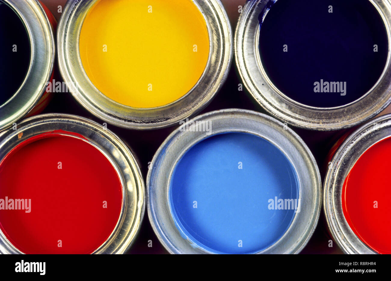 paint tins yellow paint tin red paint tin blue paint tin Stock Photo