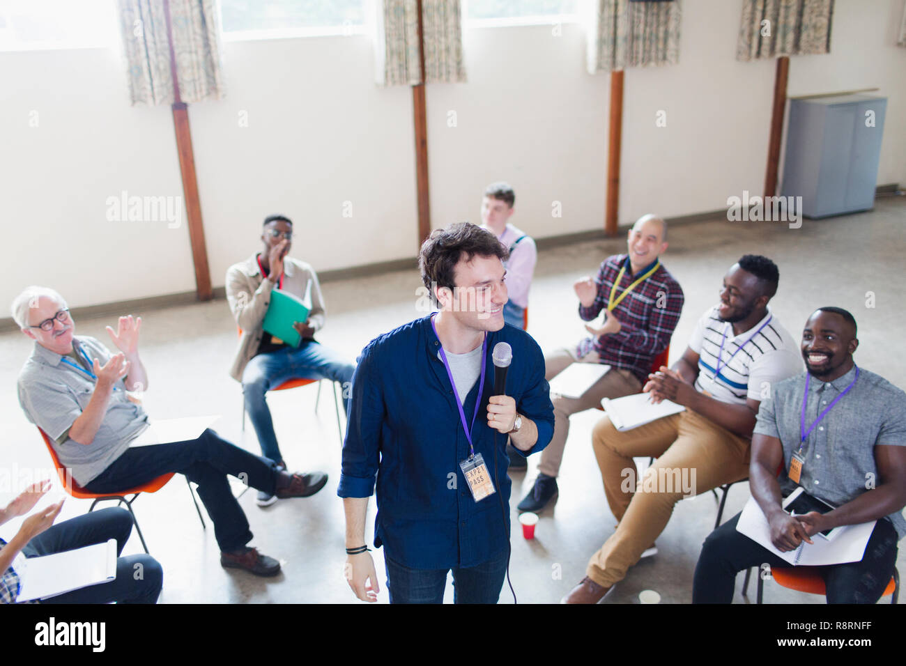 Group clapping for male speaker Stock Photo